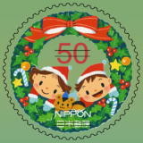 Colnect-1997-151-A-Christmas-wreath-and-children-Sasanuma-kaori.jpg