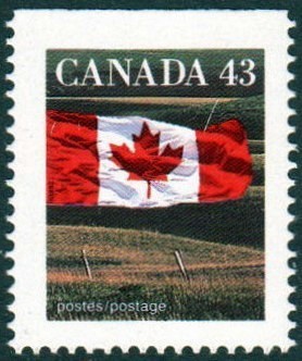 Colnect-2372-235-Canadian-Flag-over-Field.jpg