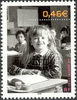 Colnect-551-289-Everyday-Life--Girl-at-School-Desk.jpg