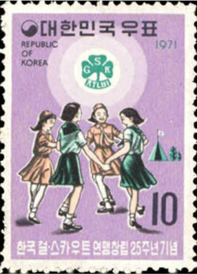 Colnect-2722-492-Girl-scouts-and-emblem.jpg