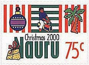 Colnect-1213-479-Christmas-Ornament-Boy-on-Toy-Train-Palm.jpg