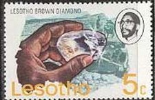 Colnect-745-739-Hand-holding-Lesotho-brown-diamond.jpg