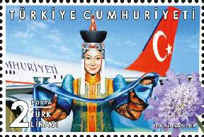 Colnect-5911-655-Turkish-Aircraft-and-Mongolian-Woman-in-Traditional-Welcome.jpg