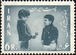Colnect-1732-387-Boy-presents-some-flowers-to-the-Crown-Prince-Cyrus-Reza.jpg