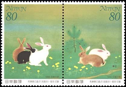 Colnect-1914-169-Rabbits-Playing-in-the-Field-in-Spring.jpg