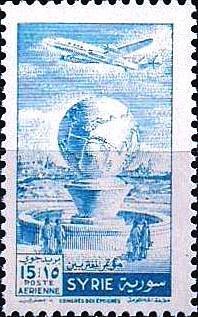 Colnect-1481-537-Airplane-over-globe-and-fountain.jpg