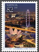 Colnect-3816-938-Singapore-Flyer-Ferris-Wheel-and-ArtScience-Museum-at-Night.jpg