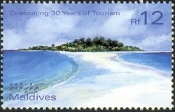 Colnect-961-975-Thirty-Years-of-Tourism---distant-sea-level-view-of-an-atoll.jpg