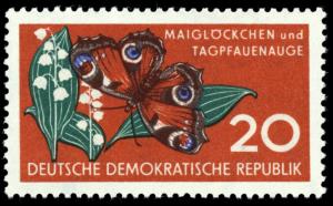 Colnect-1970-738-Peacock-Butterfly-Inachis-io-Lily-of-the-Valley-Convalla.jpg