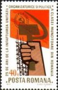 Colnect-609-498-Fist-with-hammer-and-sickle-red-flag.jpg