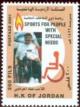 Colnect-5732-432-Man-in-wheelchair.jpg