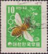 Colnect-2336-092-European-Honey-Bee-Apis-mellifera-Honeycomb-and-Clover.jpg