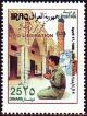 Colnect-1894-409-Saddam-Hussein-prays-in-front-of-the-mosque-in-Fao.jpg