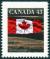 Colnect-2372-235-Canadian-Flag-over-Field.jpg