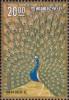 Colnect-3058-751-Peacock-spreading-its-tail-feathers-detail.jpg