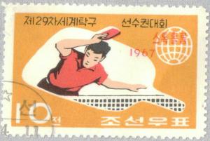 Colnect-2614-025-Table-tennis-player-and-emblem-of-the-World-Table-Tennis-Cha.jpg