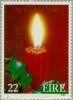 Colnect-128-813-Lighted-candle-and-holly.jpg
