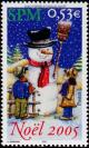 Colnect-878-817-Children-watching-a-snowman.jpg