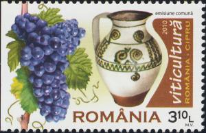Colnect-6138-416-Grapes-and-Wine-Pitcher.jpg