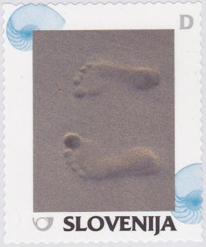 Colnect-2372-385-Summer-Footprints-in-the-sand.jpg