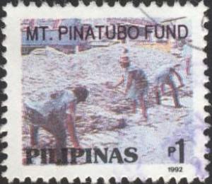 Colnect-2260-595-Mt-Pinatubo-Fund--People-shovelling-ash.jpg