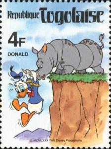 Colnect-7482-630-Donald-dangling-over-the-cliff-edge-from-the-horn-of-a-Rhino.jpg