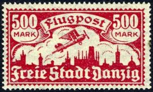 Colnect-1607-911-Airplane-flying-over-the-silhouette-of-the-skyline-of-Danzig.jpg