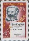 Colnect-470-142-Karl-Marx---his-book--The-Capital--1867.jpg