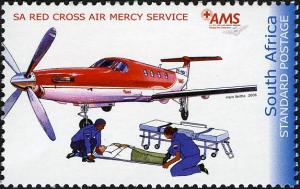 Colnect-2220-844-Airplane-paramedics-tending-to-man-on-stretcher.jpg
