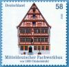 Colnect-1587-679-Middel-German-half-timbered-building-in-Dinkelsb-uuml-hl.jpg