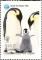 Colnect-3532-404-Couple-of-imperial-penguins-with-cub.jpg
