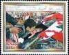 Colnect-1401-689-Child-kissing-picture-of-Pres-Hariri.jpg