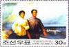 Colnect-2415-365-Mao-walking-on-shore-with-woman.jpg