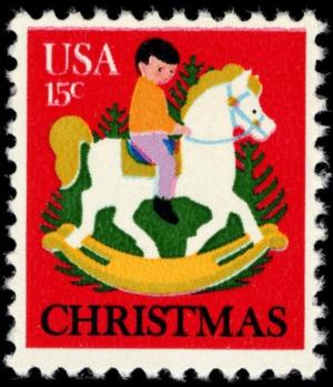 Colnect-3458-193-Child-on-Rocking-Horse-and-Christmas-Tree.jpg