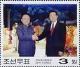 Colnect-2609-821-Kim-shaking-hands-with-Hu-Jintao.jpg