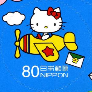 Colnect-3048-772-HELLO-KITTY-flying-an-airplane.jpg