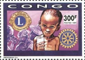Colnect-5770-534-Starving-child-Lions-and-Rotary-Clubs-emblems.jpg