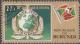 Colnect-1975-623-INTERPOL-Emblem-Burundian-Flag.jpg