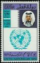 Colnect-2186-206-The-Emir-and-the-UN-Emblem.jpg
