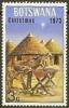 Colnect-1753-394-Ass-and-foal-African-huts.jpg