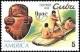 Colnect-1621-768-Stone-carving-Indians-in-dugout-canoe.jpg