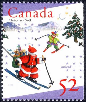 Colnect-2880-000-Santa-and-elf-Skiing.jpg
