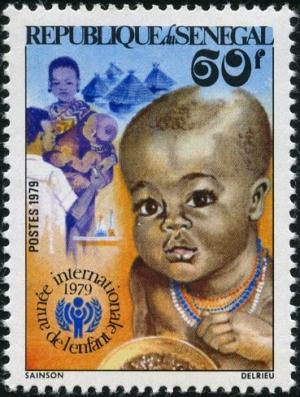 Colnect-1961-588-Infant-Physician-Vaccinating-Child-IYC-emblem.jpg