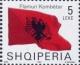 Colnect-1533-615-Albanian-flag-blowing-in-wind.jpg