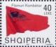 Colnect-1533-619-Albanian-flag-blowing-in-wind.jpg