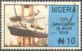 Colnect-3869-556-Niger-Dock---Boat-being-lifted.jpg
