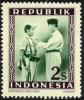 Colnect-3332-388-President-Soekarno-decorates-a-soldier.jpg