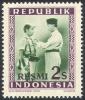 Colnect-4393-356-President-Soekarno-decorates-a-soldier.jpg