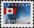 Colnect-570-136-Flag-in-front-of-Canada-Post-Ottawa.jpg
