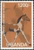 Colnect-2004-931-Dark-brown-and-gray-brown-horse-facing-right-with-and-feet-o.jpg